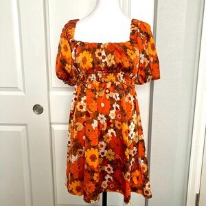 Short sleeve flowered mini dress. Great with a pair of boots and a jean jacket.